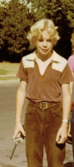 Carl holding a handheld police scanner in 1980